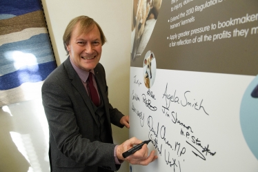 Sir David signs pledge to protect racing greyhounds